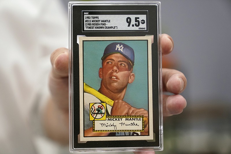 A Mickey Mantle baseball card is displayed at Heritage Auctions in Dallas, Thursday, July 21, 2022. The mint-condition Mantle card is expected to sell well into the millions when bidding ends at the end of the month. (AP Photo/LM Otero)