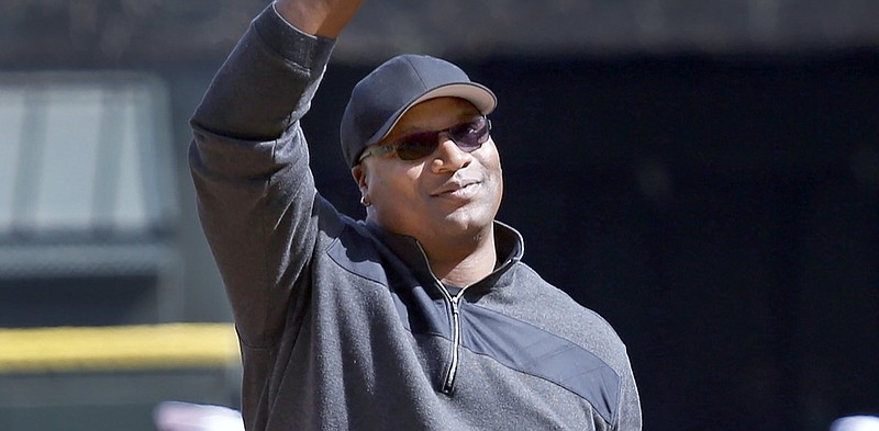 FILE - Former Chicago White Sox great Bo Jackson waves to the crowd before throwing the ceremonial first pitch before the White Sox and Kansas City Royals season opening baseball game Monday, April 1, 2013, in Chicago. Jackson helped pay for the funerals of the 19 children and two teachers killed in the Uvalde, Texas, school massacre in May 2022. The donation was previously anonymous but Jackson told The Associated Press this week he felt compelled to support the victims' families after the loss of so many children. (AP Photo/Charles Rex Arbogast, File)