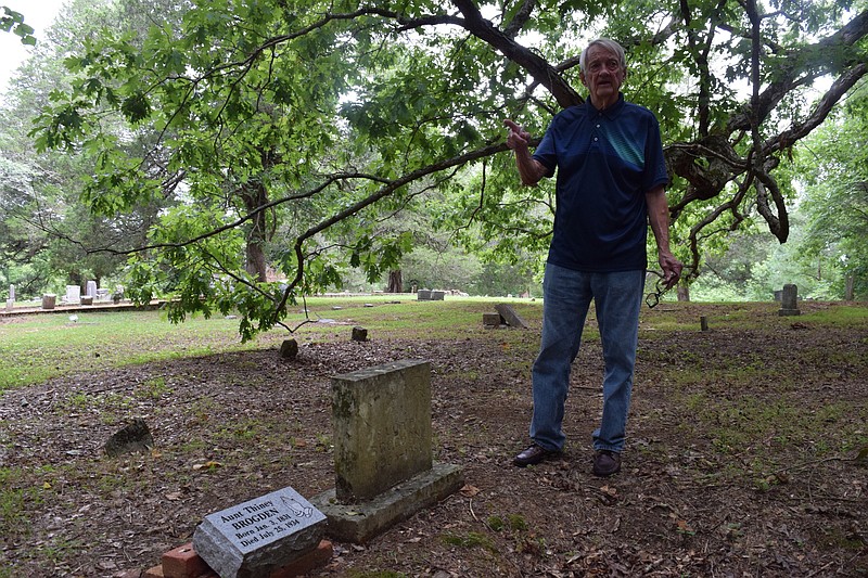 Staff Photo by Ben Benton / Dade County, Ga., resident Rex Blevins on Monday stands behind a stone he installed at Sarah's Chapel Cemetery to mark the grave of former slave Parthenia "Aunt Thenie" Strickland Brogden. Brogden was born in 1831 and died in Dade County in 1934.