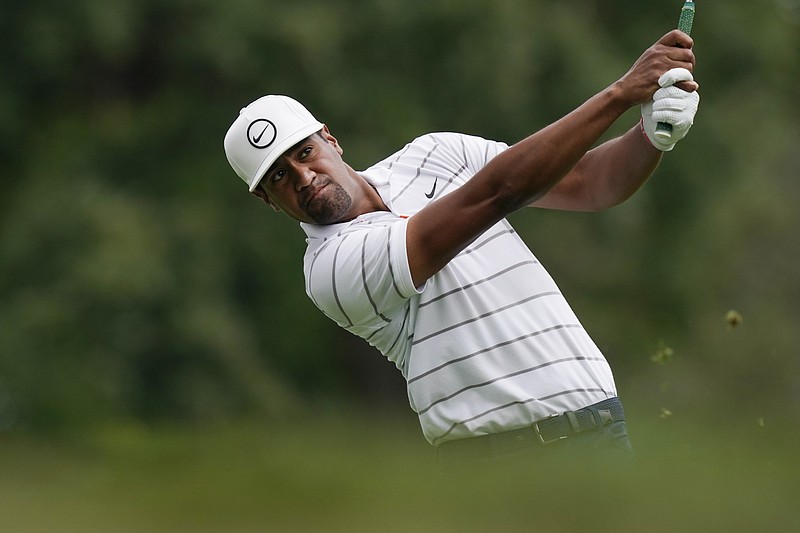 AP photo by Carlos Osorio / Tony Finau drives from the ninth tee during the first round of the PGA Tour's Rocket Mortgage Classic on Thursday in Detroit.