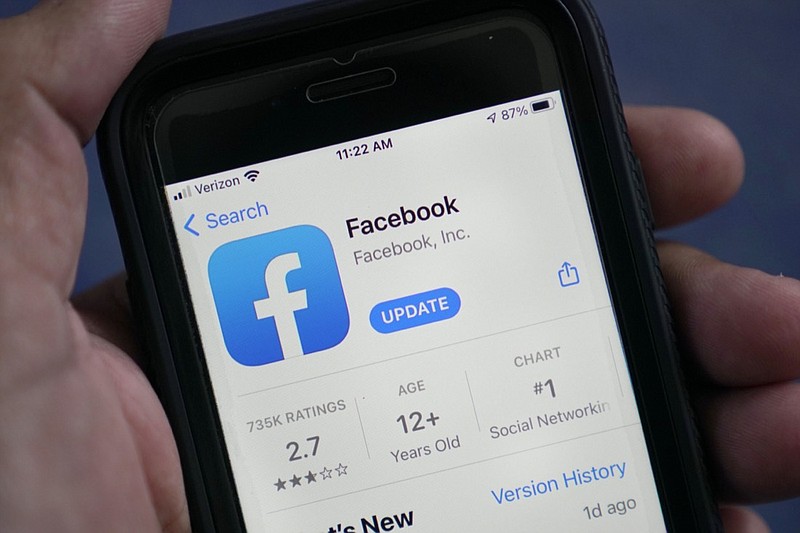 FILE - The Facebook app is shown in the app store on a smart phone in Surfside, Fla., on April 23, 2021. According to a new report from the nonprofit groups Global Witness and Foxglove, Facebook is letting violent hate speech slip through its controls in Kenya as it has in other countries. It is the third such test of Facebook's ability to detect hateful language — either via artificial intelligence or human moderators — that the groups have run, and that the company has failed. (AP Photo/Wilfredo Lee, File)

