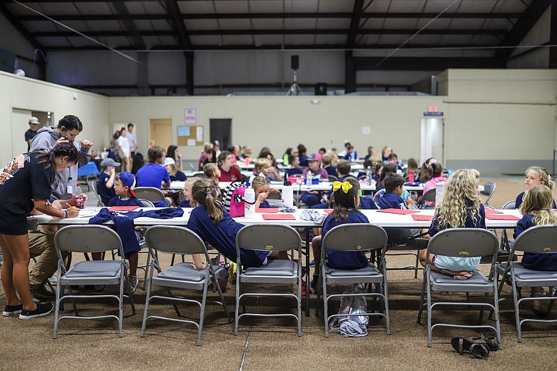 Staff photo by Olivia Ross  / Children wait for breakout groups. Lafayette Little Vet STEM Camp teaches children ages 7-12 how to care for different animals health and hygiene on July 28, 2022. 