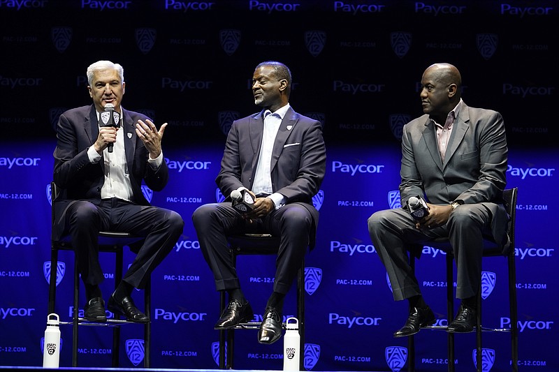 AP photo by Damian Dovarganes / From left, commissioner George Kliavkoff, senior associate commissioner Merton Hanks and Stanford athletic director Bernard Muir take questions at the Pac-12's football media day Friday in Los Angeles.