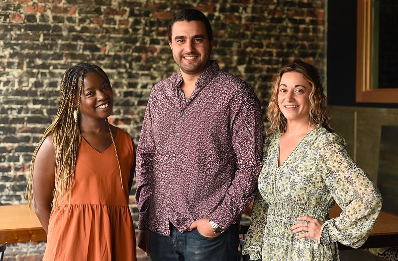 Staff photo by Matt Hamilton /  From left, Clecia Joi Mason, Khaled Albanna and Raven Humphrey at Proof Bar and Incubator on Saturday, July 30, 2022. 