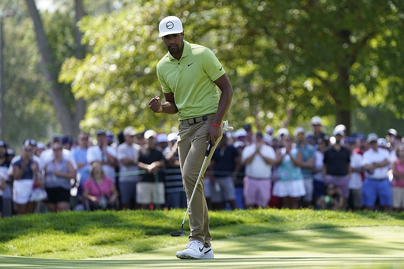 AP photo by Carlos Osorio / Tony Finau reacts after making his putt for par on the ninth green during the final round of the Rocket Mortgage Classic on Sunday at Detroit Golf Club.