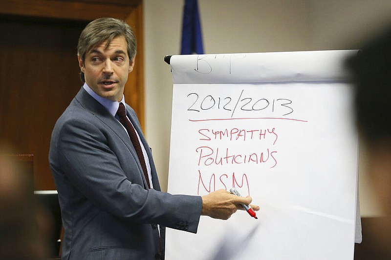 Alex Jones' lawyer Andino Reynal gives his opening statement to the jury, Tuesday, July 26, 2022, at the Travis County Courthouse in Austin, Texas. (Briana Sanchez/Austin American-Statesman via AP, Pool)