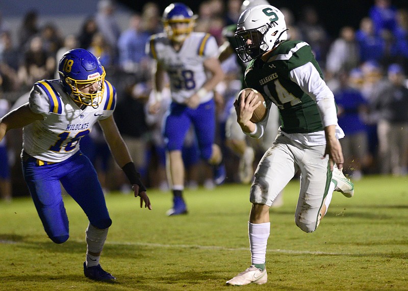 Staff file photo by Robin Rudd / Silverdale Baptist Academy quarterback Brett Rogers, right, is back at quarterback for his senior season after accounting for more than 2,000 yards in 2021.