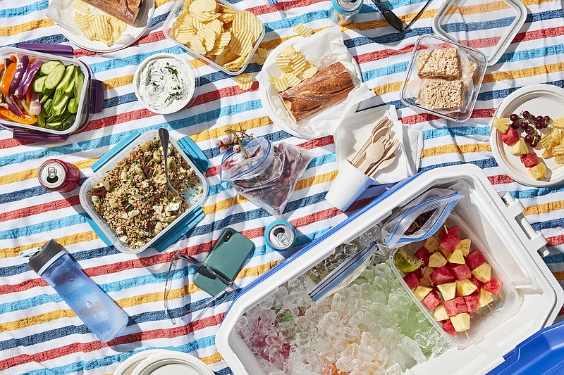 A day at the beach is made all the more enjoyable with a thoughtfully packed cooler full of sandwiches, salads and dips that can withstand a day on ice. / Christopher Testani/The New York Times