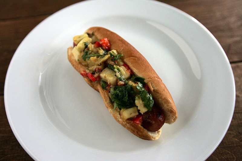 William Archie/Detroit Free Press/TNS / A gourmet Manchego cheese and garlic hot dog made in a test kitchen is pictured.