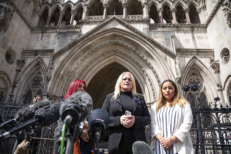 The mother of Archie Battersbee, Hollie Dance, centre, speaks to the media outside the Royal Courts of Justice, London, on July 25, 2022. (Dominic Lipinski/PA via AP)


