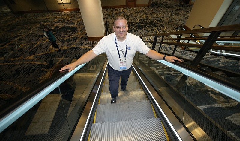 Student resource officer Tony Ramaeker, from Elkhorn, Neb., heads up an escalator while attending a convention, Tuesday, July 5, 2022, in Denver. (AP Photo/David Zalubowski)

