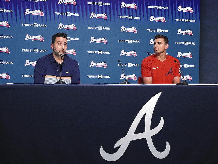 Atlanta Braves third baseman Austin Riley, right, and Braves general manager Alex Anthopoulos hold a news conference after Riley signed a 10-year, $212 million deal that runs through the 2032 season and includes a $20 million club option for 2033, on Tuesday, Aug. 2, 2022, in Atlanta. (Curtis Compton/Atlanta Journal-Constitution via AP)