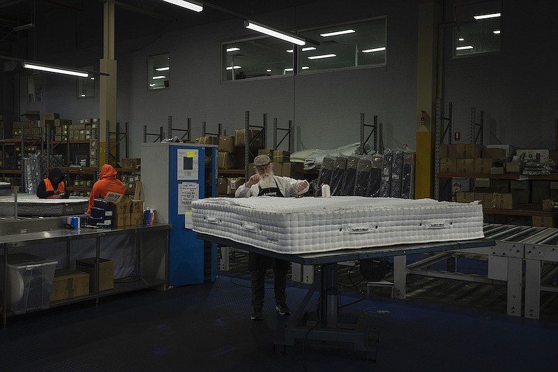 Workers at A.H. Beard, a 123-year-old, family-owned mattress manufacturer in Padstow, Australia, on July 21, 2022. The company sells many of its high-end mattresses in China. (Matthew Abbott/The New York Times)