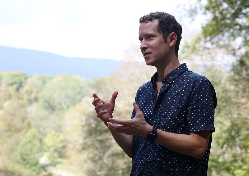 Staff File Photo / Mark McKnight, president and chief executive officer of Reflection Riding Arboretum and Nature Center, talks about the topography of the land — with Lookout Mountain in the background — at Reflection Riding Arboretum and Nature Center in 2017.