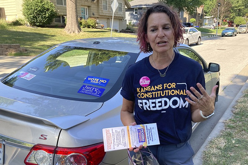 (AP File Photo by John Hanna / Anne Melia in July went door-to-door in Merriam, Kansas, to discuss her opposition to a proposed amendment to the Kansas Constitution that would allow legislators to further restrict or ban abortion. Voters last week resoundingly defeated the amendment.