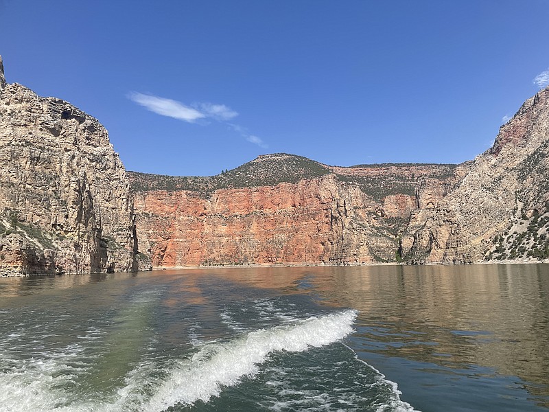 Photo by Anne Braly / A cruise of the Bighorn River will take you past cliffs streaked with red from the oxidized iron minerals found in the sandstone.