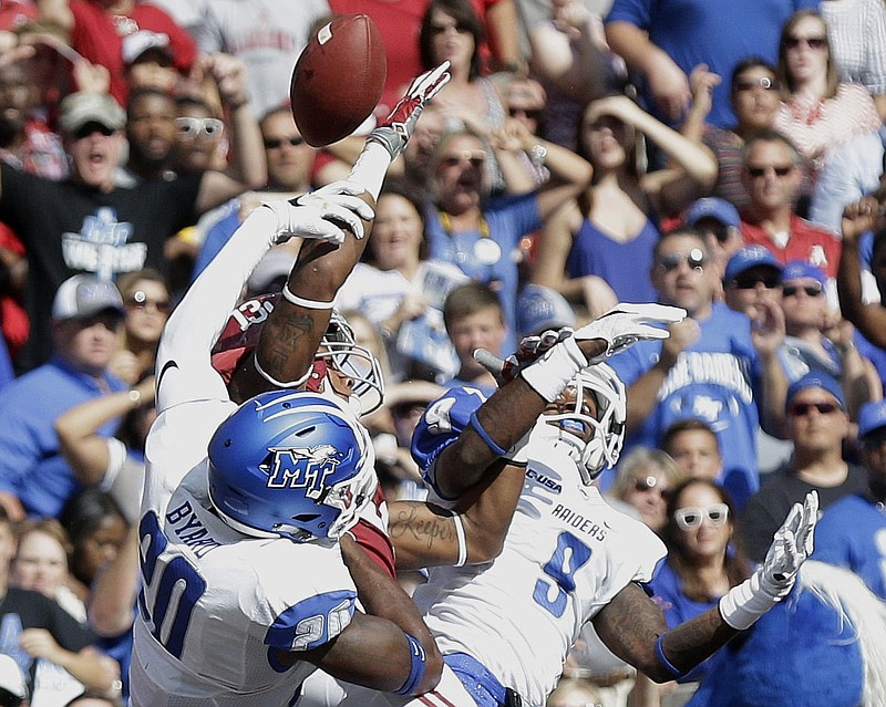 AP photo by Brynn Anderson / Middle Tennessee State safety Kevin Byard, left, helps break up a pass intended for Alabama receiver Ardarius Stewart during a September 2015 game in Tuscaloosa. Byard, now in training camp for his seventh NFL season with the Tennessee Titans, will have his No. 20 retired by his college alma mater this fall.