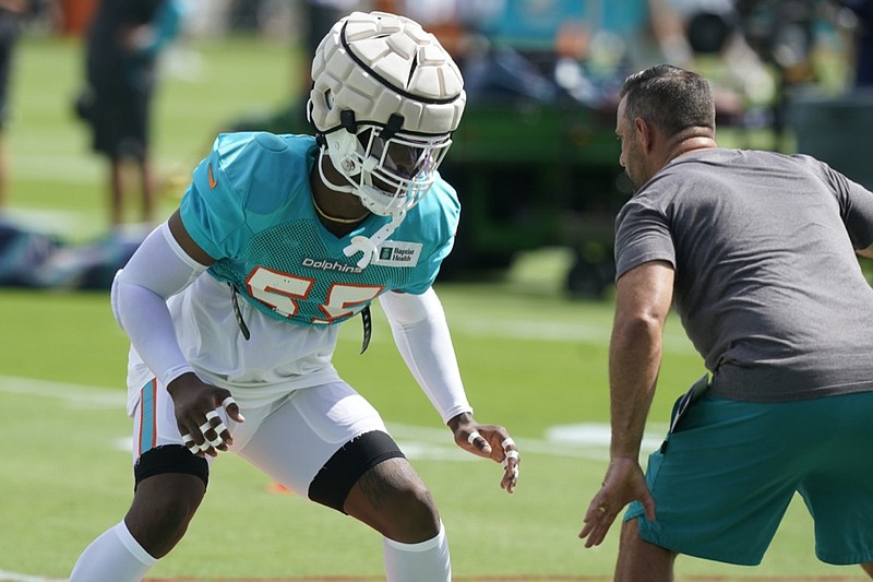 Miami Dolphins linebacker Jerome Baker (55) takes part in drills at the NFL football team's practice facility, Tuesday, Aug. 2, 2022, in Miami Gardens, Fla. (AP Photo/Marta Lavandier)