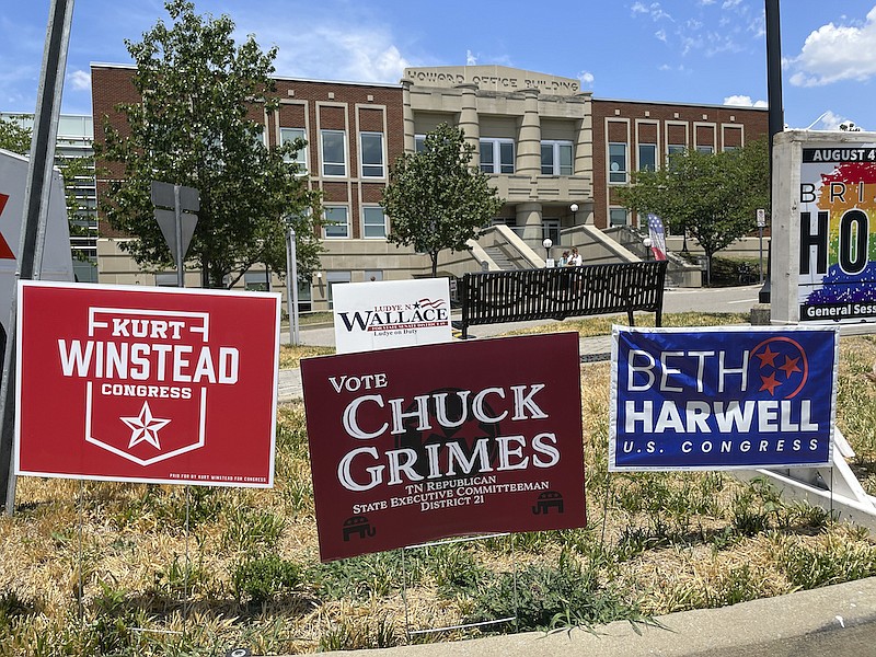 Campaign signs are posted outside a polling location on the first day of early voting on July 15, 2022, in Nashville, Tenn. GOP lawmakers redistricted the left-leaning city early this year, splitting its one seat into three to help Republicans gain a seat. (AP Photo/Jonathan Mattise, File)