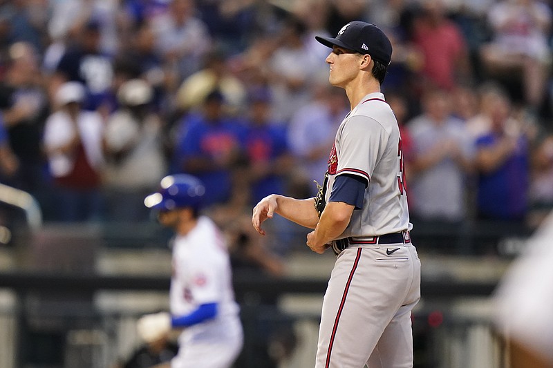 AP photo by Frank Franklin II / Atlanta Braves starter Kyle Wright waits as the New York Mets' Tyler Naquin runs the bases after hitting a home run during the second inning of Thursday night's game in New York.
