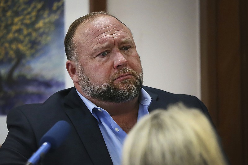  In this Aug 3, 2022 file photo, conspiracy theorist Alex Jones attempts to answer questions about his emails during trial at the Travis County Courthouse in Austin. An attorney representing two parents who sued Jones over his false claims about the Sandy Hook massacre says the U.S. House Jan. 6 committee has requested two years' worth of records from Jones' phone. Attorney Mark Bankston said in court Thursday, Aug. 4, 2022 that the committee investigating the attack on the U.S. Capitol has requested the digital records. (Briana Sanchez/Austin American-Statesman via AP, Pool, File)