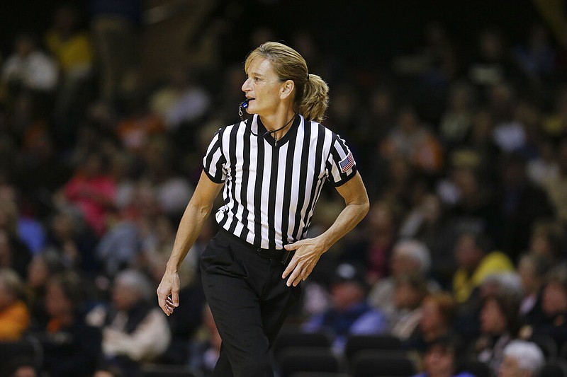 Referee Dee Kantner works in the second half of an NCAA college basketball game between Tennessee and Vanderbilt Monday, Jan. 5, 2015, in Nashville, Tenn. Kantner, a veteran referee of women's games who works for multiple conferences, finds it frustrating to have to justify equal pay. "If I buy an airline ticket and tell them I'm doing a women's basketball game they aren't going to charge me less," she said. (AP Photo/Mark Humphrey, FILE)