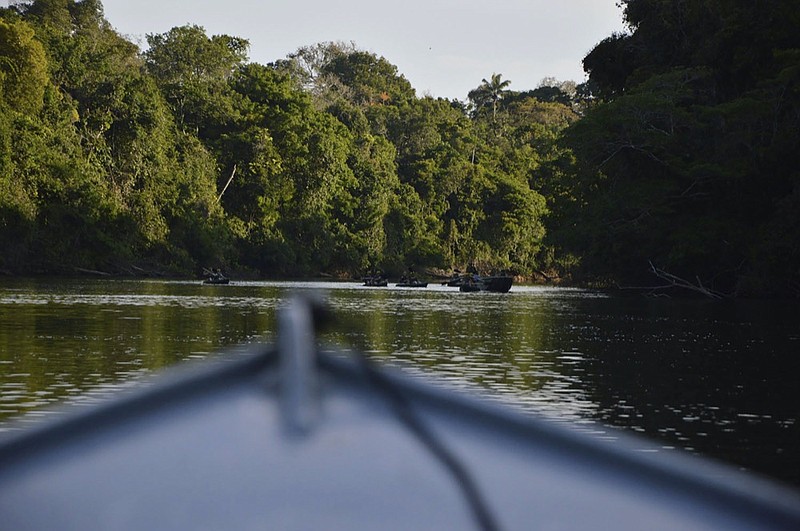In this July 22, 2019 photo provided by Rodrigo Vargas, a boat moves through the in Cristalino II State Park in the state of Mato Grosso, in Brazil. (Rodrigo Vargas via AP)


