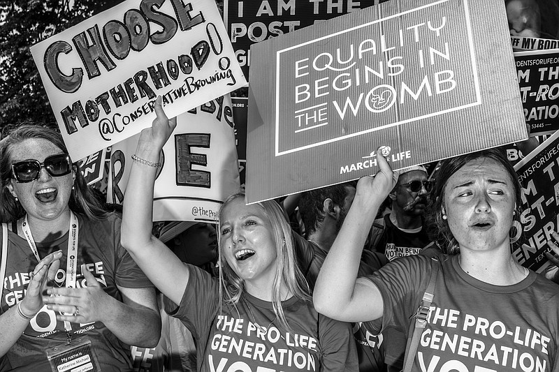 Photo by Mark Peterson of The New York Times / Anti-abortion demonstrators outside the U.S. Supreme Court on the day it overturned its Roe vs. Wade ruling that protected abortion rights, in Washington, D.C., on June 24, 2022.