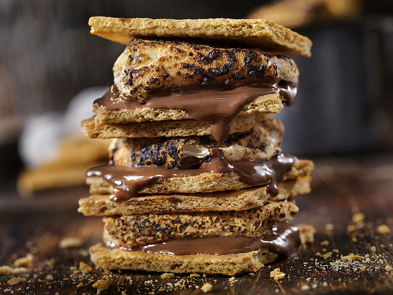 Getty Images/ Traditional s'mores are made with roasted marshmallows, bar chocolate and graham crackers, but the ingredients can be customized to personal preference.