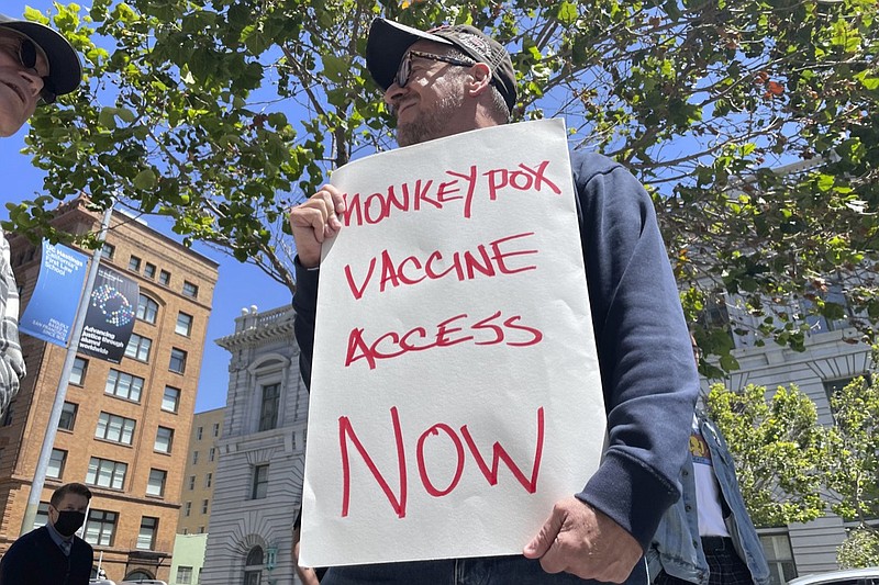 A man holds a sign urging increased access to the monkeypox vaccine during a protest in San Francisco, July 18, 2022.  (AP Photo/Haven Daley, File)


