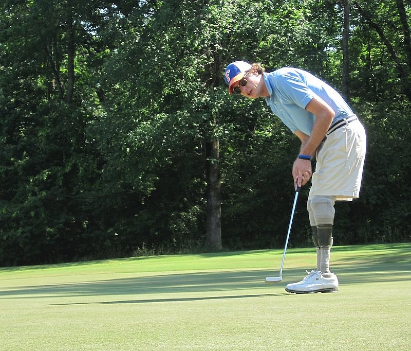 Staff file photo / Jordan Thomas, former McCallie golfer, practices at Bear Trace Golf Course in 2012.