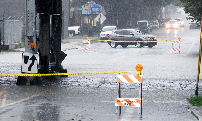 Staff Photo by Robin Rudd /  Traffic turns around on East 11th Street to avoid highwater.  Heavy rains caused flash flooding in the Chattanooga area, as East 11th Street was closed by high water at the Norfolk Southern Railroad bridge, on August 10, 2022.  