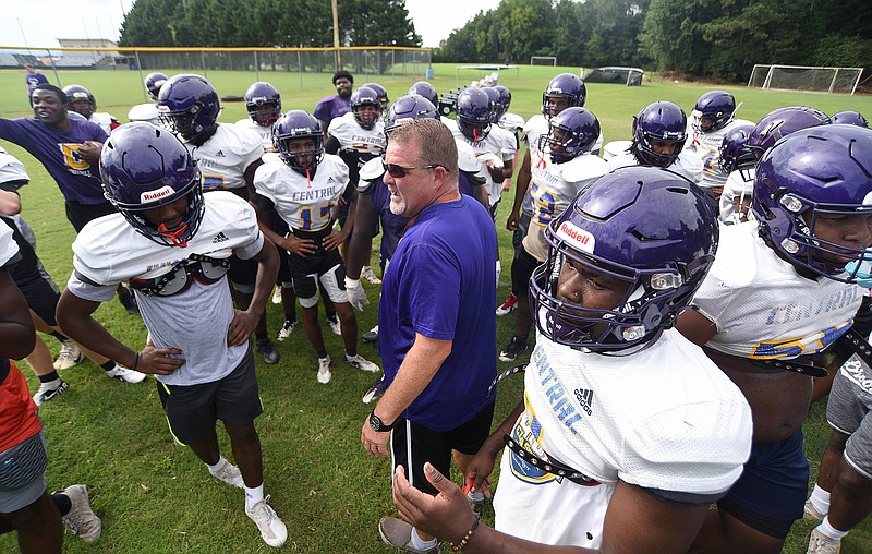 Staff photo by Matt Hamilton / Central coach Curt Jones talks to his players at the start of practice in late July. High school football's regular season kicks off next week in Tennessee, and Jones' Purple Pounders are among the 23 teams that will take part in the Best of Preps of football jamboree this week. The three-day event starts Thursday at Finley Stadium.