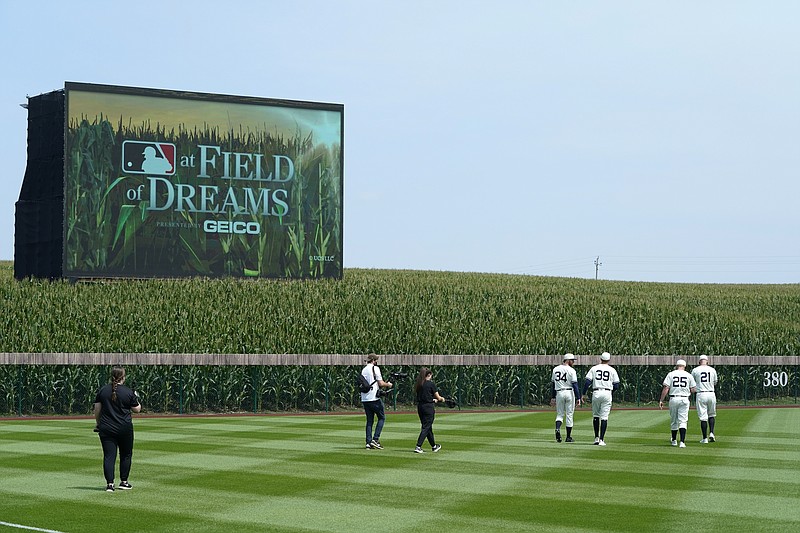 AP photo by Charlie Neibergall / Chicago White Sox players walk on the field before facing the New York Yankees in MLB's first "Field of Dreams" game on Aug. 12, 2021, in Dyersville, Iowa. The Chicago Cubs and Cincinnati Reds will continue the tradition Thursday night when MLB returns to the site.