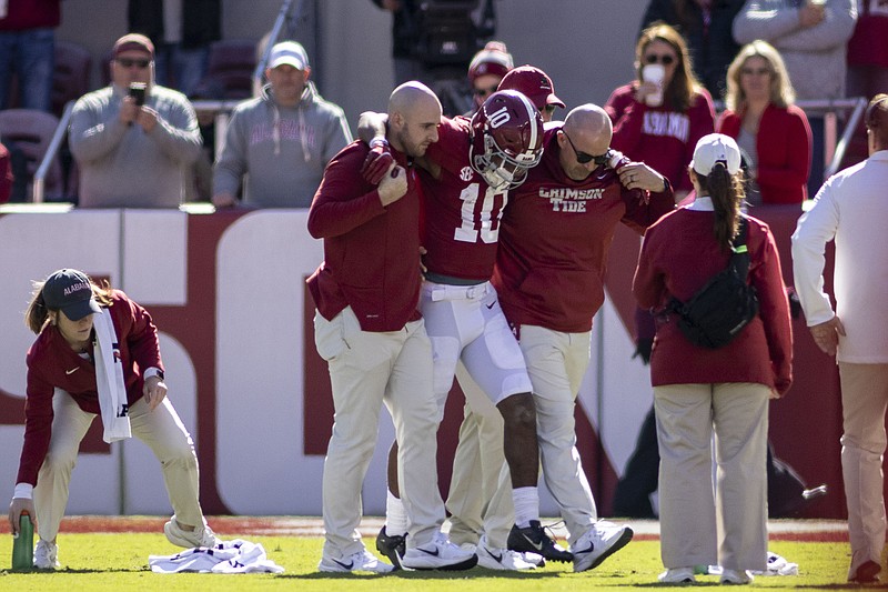 AP photo by Vasha Hunt / Alabama wide receiver JoJo Earle is helped off the field after sustaining a leg injury during a home game against New Mexico State last November. Earle missed three games late in the 2021 season, and he will miss the start of this season with a broken foot.