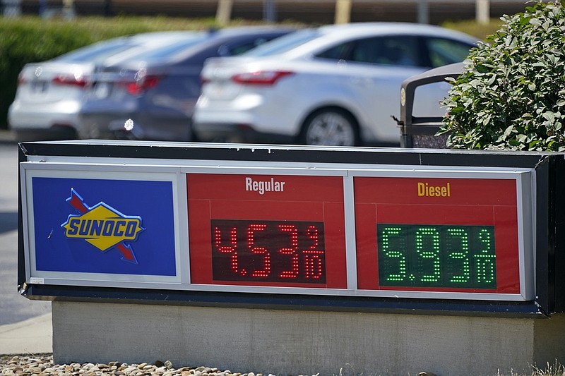 FILE - Gas prices are displayed at a Sunoco gas station along the Ohio Turnpike near Youngstown, Ohio, Tuesday, July 12, 2022. Thanks largely to falling gas prices, the government's inflation report for July, to be released Wednesday, Aug. 10, 2022, will probably show that prices jumped 8.7% from a year earlier, according to a survey of economists by data provider FactSet. (AP Photo/Gene J. Puskar, File)