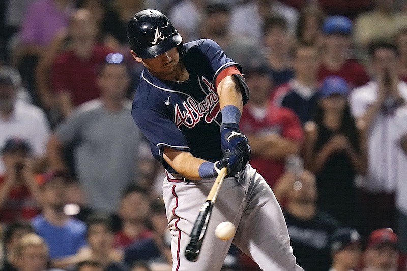 Atlanta Braves' Austin Riley connects on a two RBI single during the 11th inning of a baseball game against the Boston Red Sox, Tuesday, Aug. 9, 2022, in Boston. (AP Photo/Charles Krupa)
