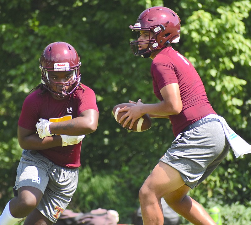 Staff photo by Patrick MacCoon / Tyner quarterback Josh Jackson, right, has a big arm that he will unleash on opposing secondaries this fall.