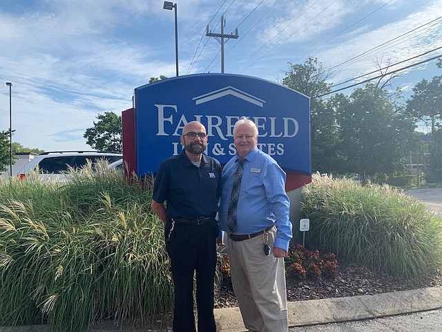 Contributed photo / Mark Hart, Fairfield By Marriott in East Ridge general manager, at left, and front desk staff member Clyde Hampstead support the Mission Accomplished: Stable Housing (M.A.S.H) supportive program for veteran families that is funded by the Department of Veterans Affairs.