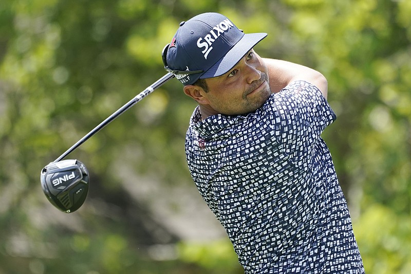 AP photo by Mark Humphrey / J.J. Spaun hits from the 18th tee at TPC Southwind during the first round of the FedEx St. Jude Championship on Thursday in Memphis. Spaun shot a 62 to share the lead with Si Woo Kim in the opening event of the PGA Tour's FedEx Cup playoffs.