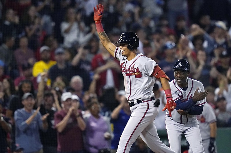 Atlanta Braves' Vaughn Grissom celebrates while running the bases on his two-run home run against the Boston Red Sox during the seventh inning of a baseball game Wednesday, Aug. 10, 2022, in Boston. At right is Braves third base coach Ron Washington. (AP Photo/Charles Krupa)