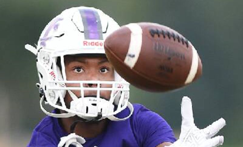 Staff photo by Matt Hamilton / Marion County junior Brody Leonard catches a pass during a July practice for the Warriors.
