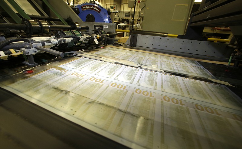 Sheets of uncut $100 run through a printing press at the Bureau of Engraving and Printing Western Currency Facility in Fort Worth, Texas. Retirement can loom like a dark cloud for small-business owners.