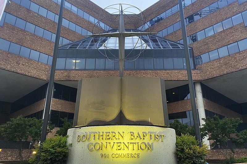 A cross and Bible sculpture stand outside the Southern Baptist Convention headquarters in Nashville, Tenn., on May 24, 2022. (AP Photo/Holly Meyer, File)