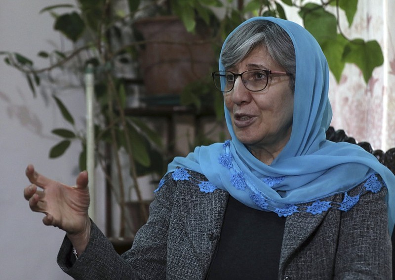 Sima Samar, a prominent activist and physician, who has been fighting for women's rights in Afghanistan for the past 40 years, speaks during an interview at her house in Kabul, Afghanistan, on March 6, 2021, six months before the Taliban takeover of her country. A year after that seismic shift, Samar says that she is still heartbroken over what happened to Afghanistan. (AP Photo/Rahmat Gul)


