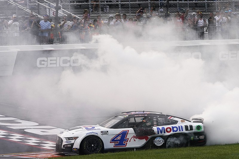 AP photo by Steve Helber / Stewart-Haas Racing driver Kevin Harvick celebrates after winning Sunday's race at Virginia's Richmond Raceway.