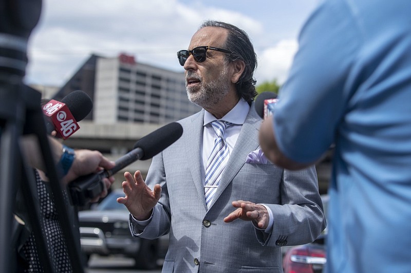 FILE - Attorney Drew Findling makes remarks regarding his client, Clayton County Sheriff Victor Hill, during a news conference outside of the Richard B. Russell Federal building in Atlanta, April 27, 2021. As more details emerge about the Georgia investigation into possible illegal attempts to influence the outcome of the state's 2020 election, people of potential interest are hiring high-profile attorneys. Word broke Thursday that former President Donald Trump has hired prominent Atlanta criminal defense attorney Findling. (Alyssa Pointer/Atlanta Journal-Constitution via AP, File)