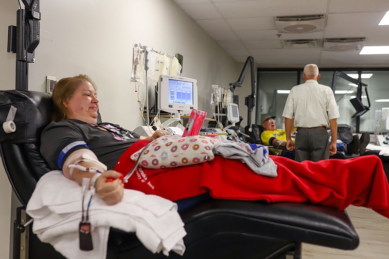 Staff photo by Olivia Ross / Hope Gordon watches a show while donating platelets on June 25, 2022 at Blood Assurance headquarters in Chattanooga.