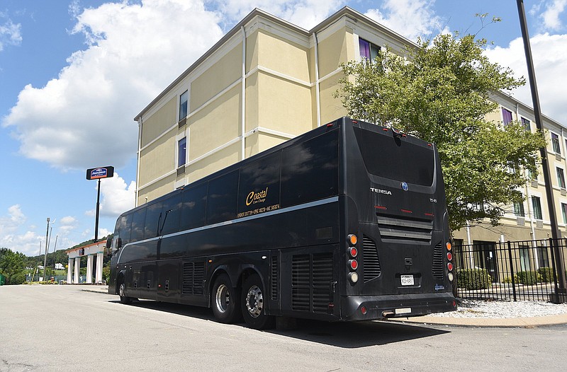 Staff file photo by Matt Hamilton / A bus parked outside the Comfort Inn & Suites Lookout Mountain is shown on Friday, Aug. 12, 2022.