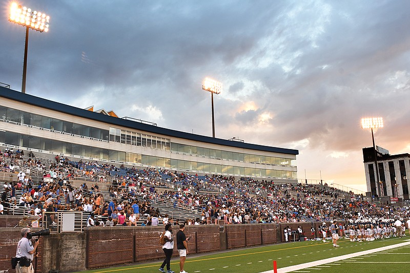 Staff Photo by Robin Rudd /  The sun sets behind a sizable crowd, at Finley Stadium, for the second night of the Best Of Pres High School Football Jamboree on August 12, 2022.